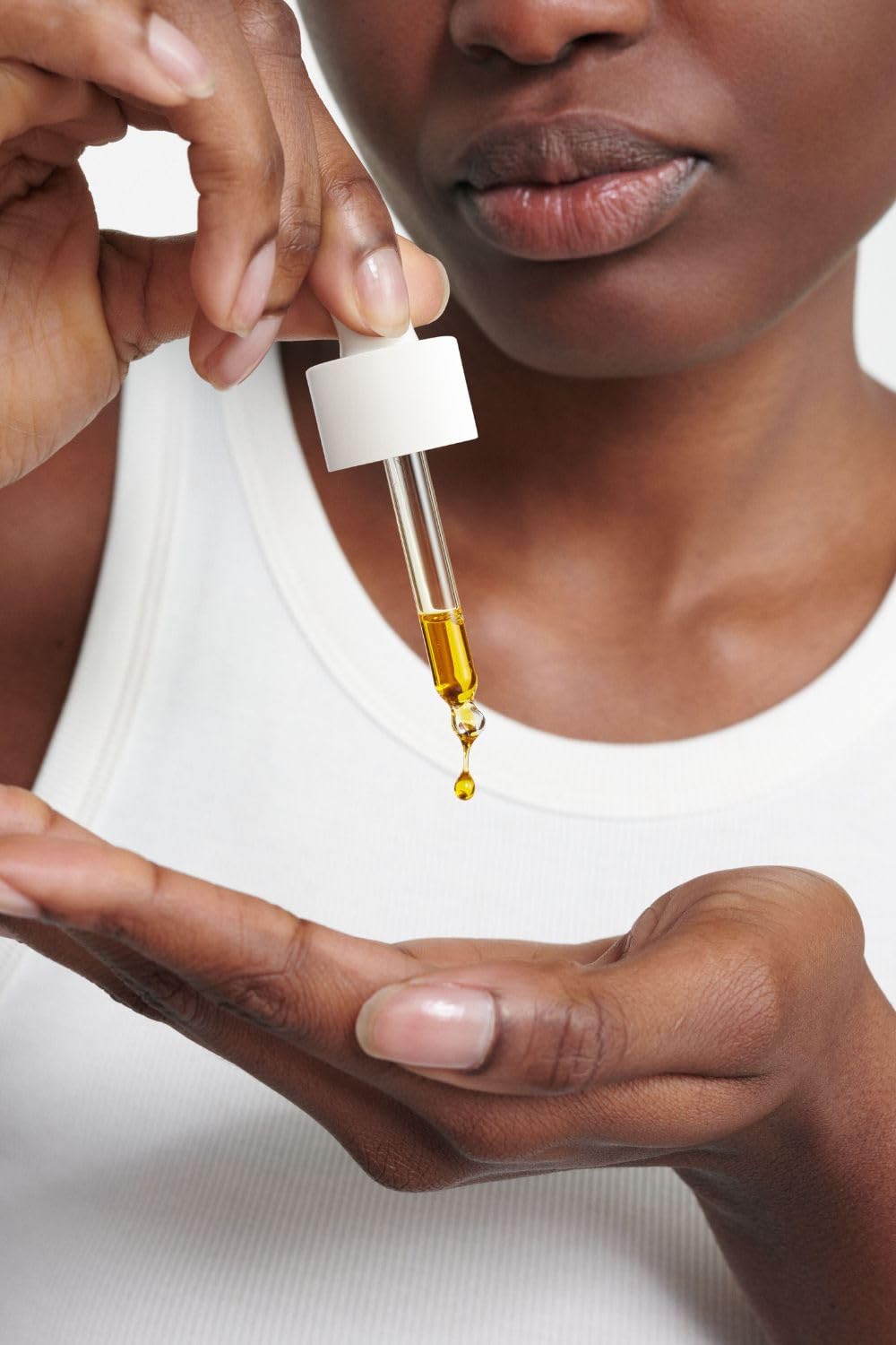 Dr. Hauschka Clarifying Day Oil application scene in a morning routine for balanced skin.