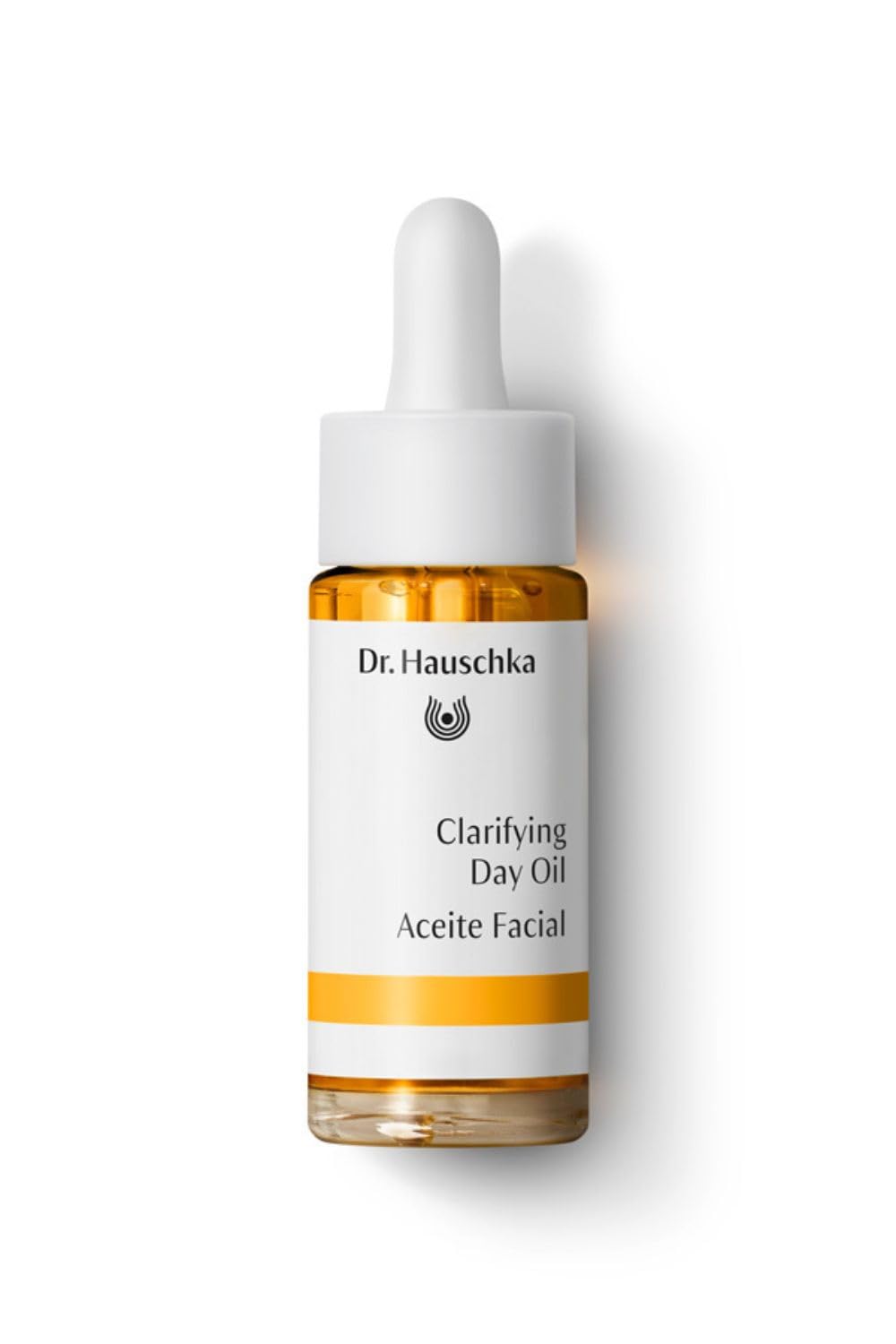 Dr. Hauschka Clarifying Day Oil bottle promoting balanced skin on a clean surface.