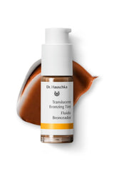 Dr. Hauschka Translucent Bronzing Tint swatch shows sheer warmth on skin.