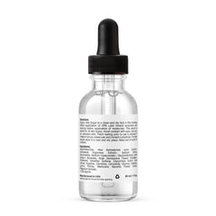 Applying DRN LABS serum to the face for smoother skin.