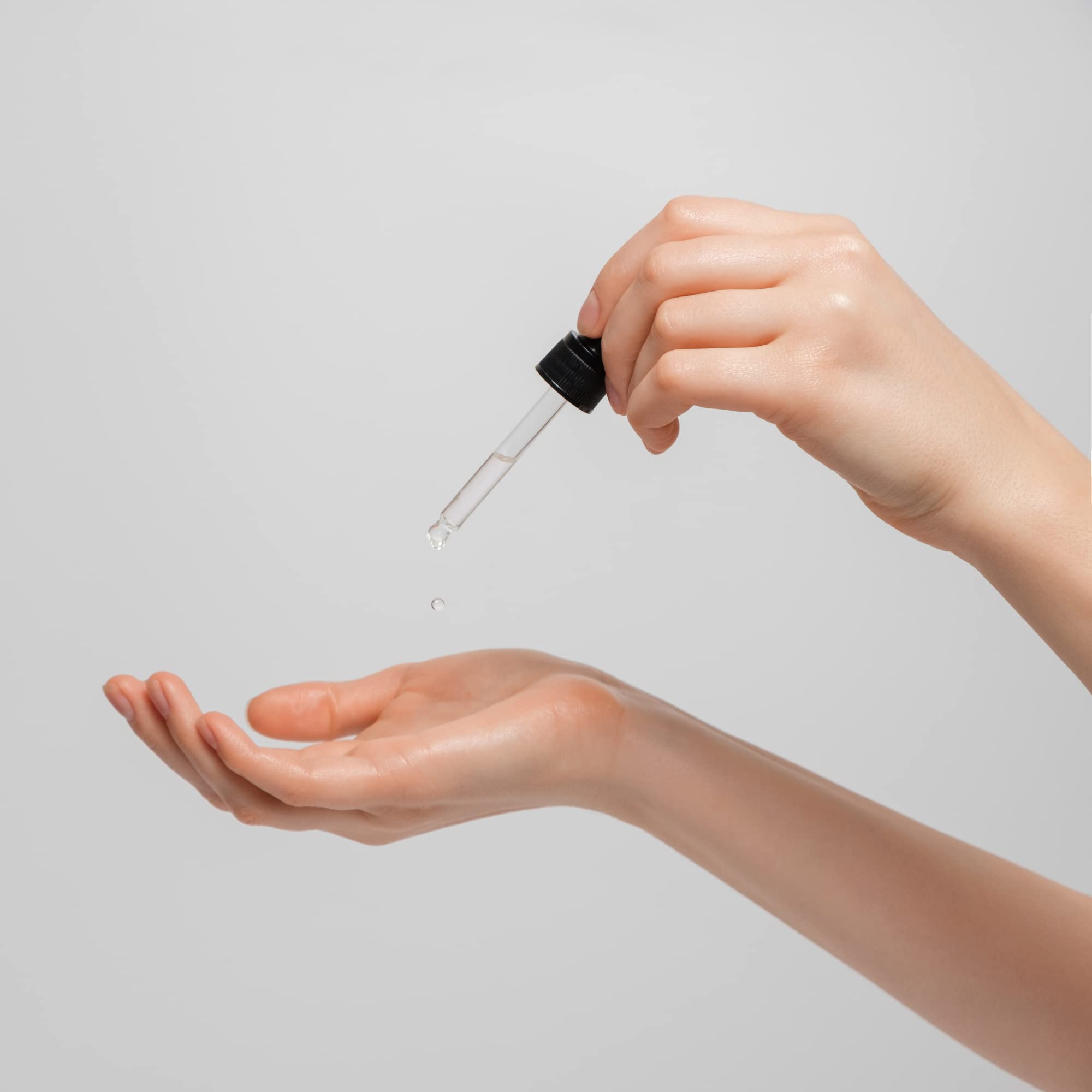 DRN LABS serum on skin demonstrates brightening effect.