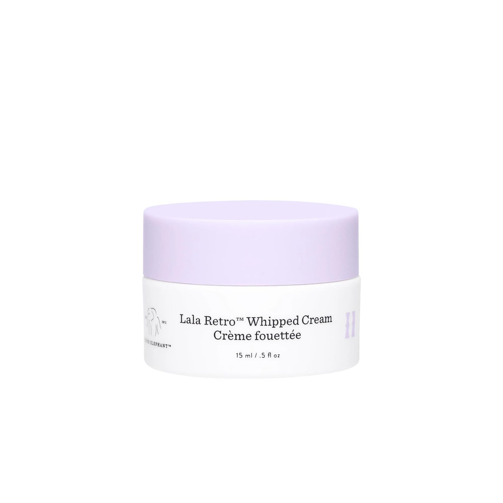 Drunk Elephant Lala Retro whipped cream jar close-up shows hydration-ready texture.
