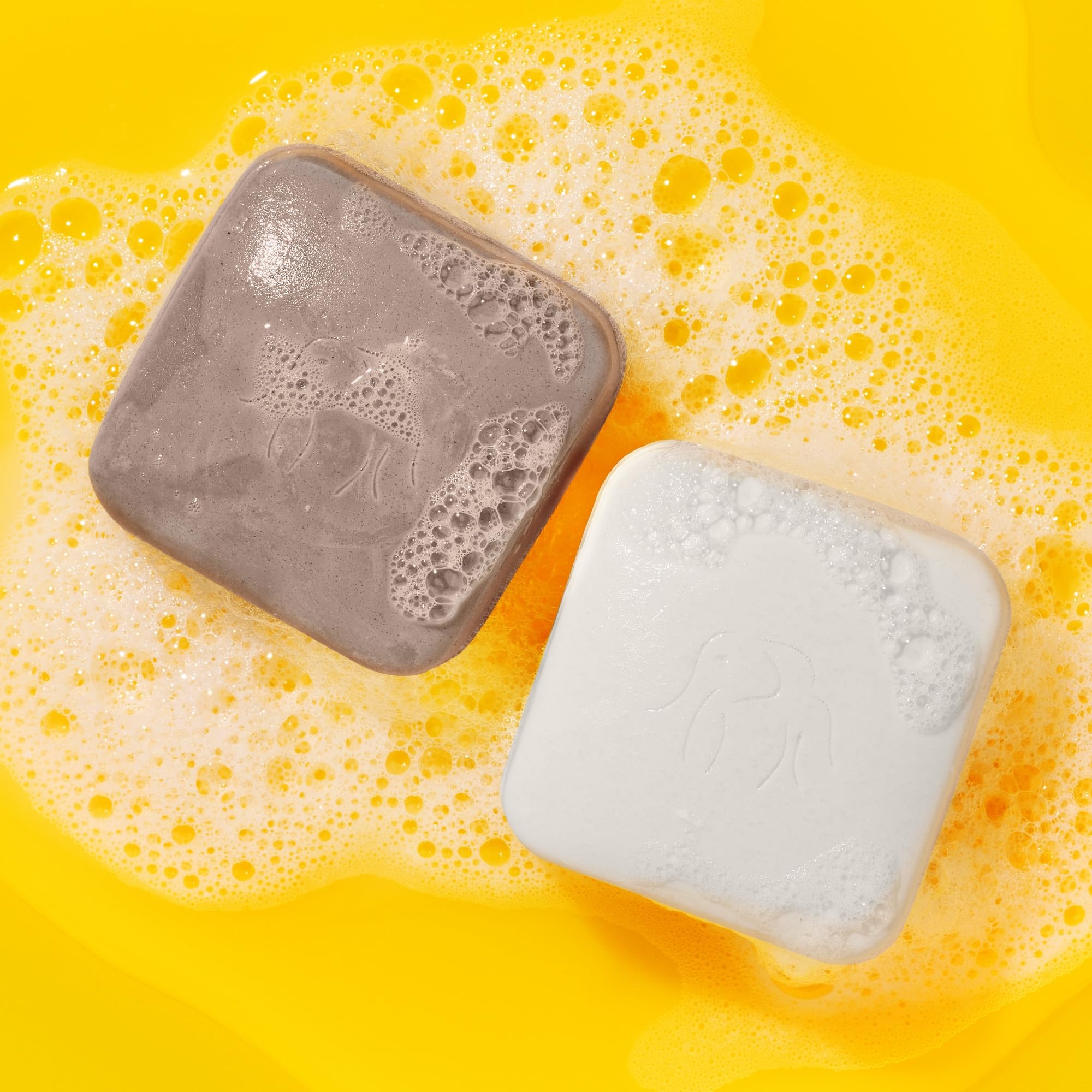 Drunk Elephant travel case keeps the bars secure and portable.