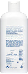 Ducray Elution lather in hand shows mild cleansing action.