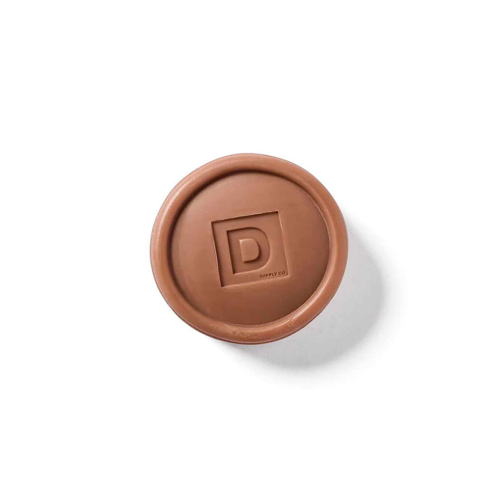 Duke Cannon bar soap puck suitable for all skin types during daily showers.
