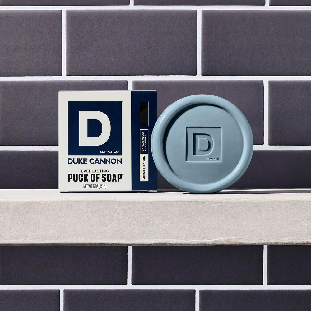 Duke Cannon four-bar packaging, Midnight Swim scent showcased in the pack.