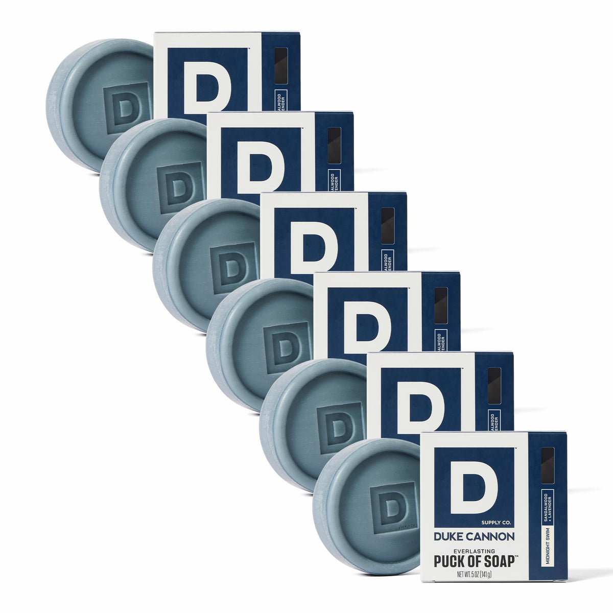 Duke Cannon Midnight Swim bar soap puck in hand for a refreshing six-pack cleanse.