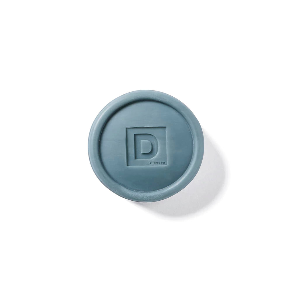 Duke Cannon bar soap puck generates a thick, satisfying lather for daily cleansing.