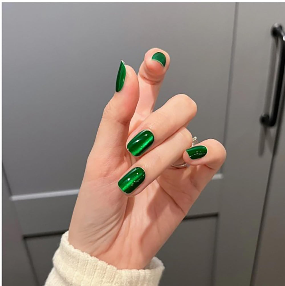 Dulyork green glitter nails closeup showing glossy sparkle and texture.