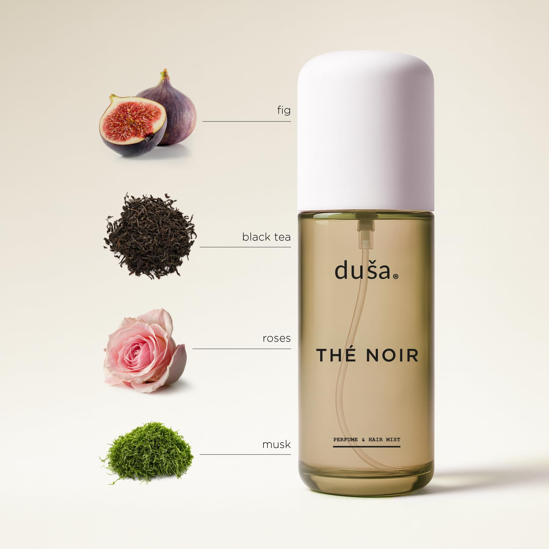 DUSA Thé Noir mist application on strands for a fresh, lasting scent.