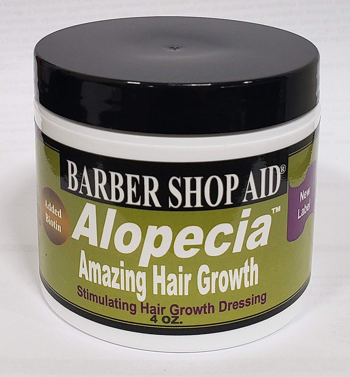 D WRIGHT ALOPECIA biotin bottle closeup showing a nourishing scalp care formula.