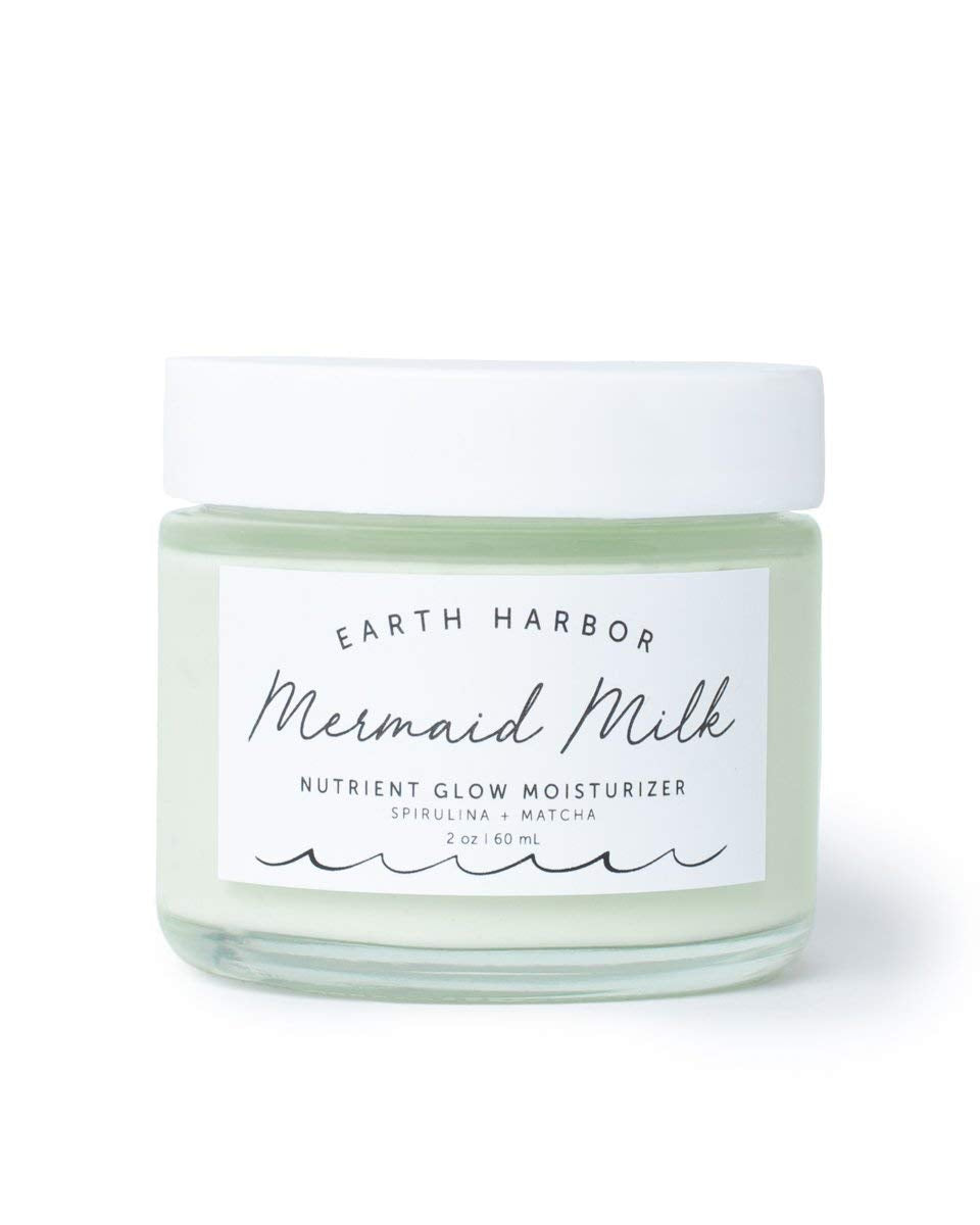 Earth Harbor Mermaid Milk bottle closeup highlighting a lightweight, hydrating formula