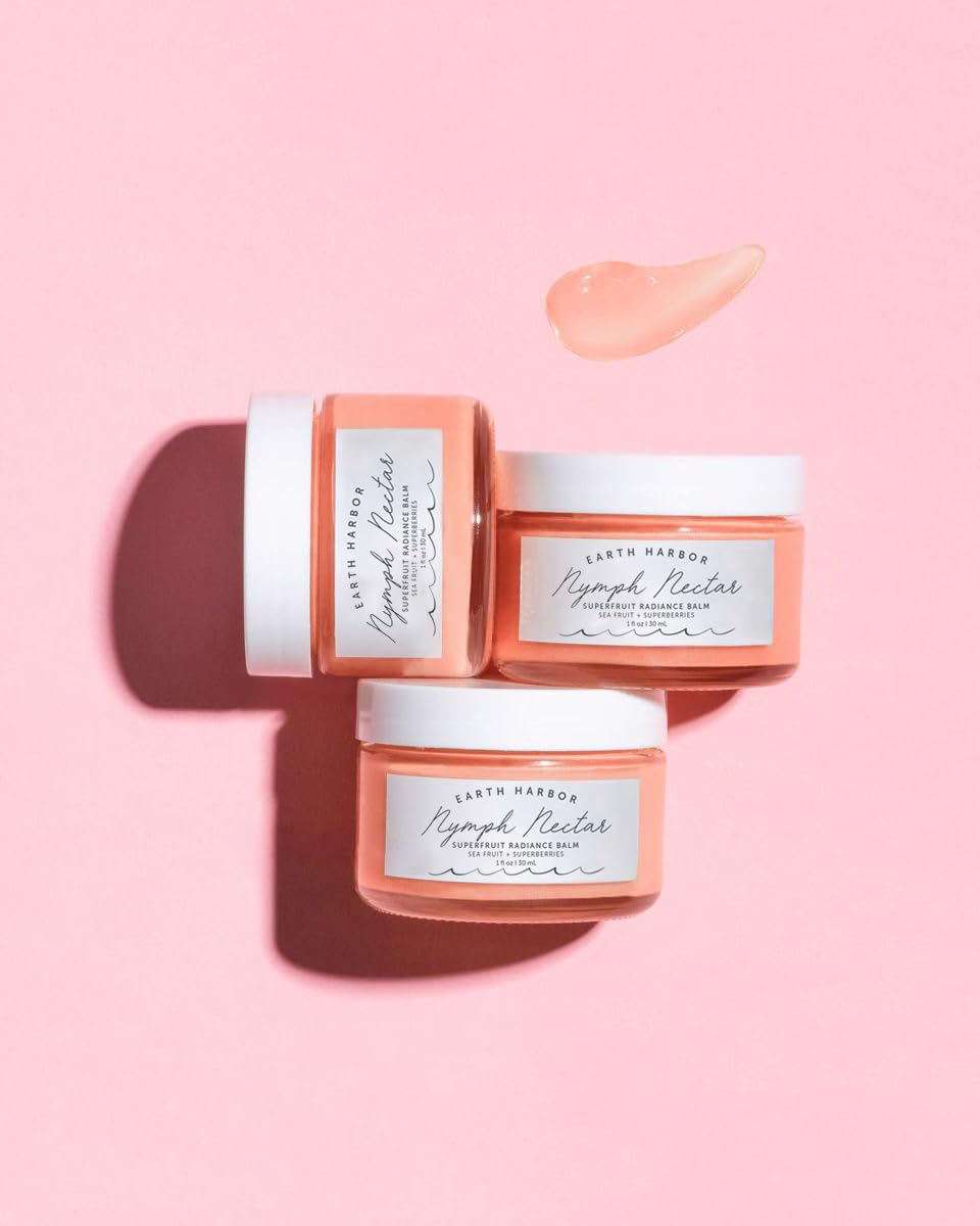 Hands applying NYMPH NECTAR balm at night for moisturized skin