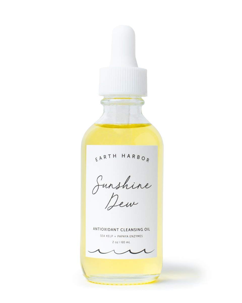 Earth Harbor Sunshine Dew bottle close-up for makeup removal and gentle cleansing