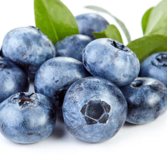 Close-up of blueberries signaling natural blueberry extract in Earth To Skin cleanser.