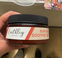 Earthley Wellness Sun Soothe bottle application shows calm, non greasy hydration after sun exposure.
