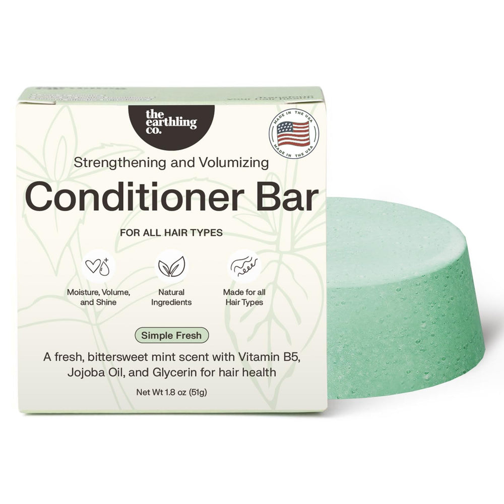 The Earthling Co. conditioner bar packaging closeup, eco-friendly design ideal for travel.