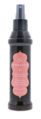 Earthly Body Marrakesh Isle of You leave-in treatment with sleek steel pin-tail comb for detangling and shine.