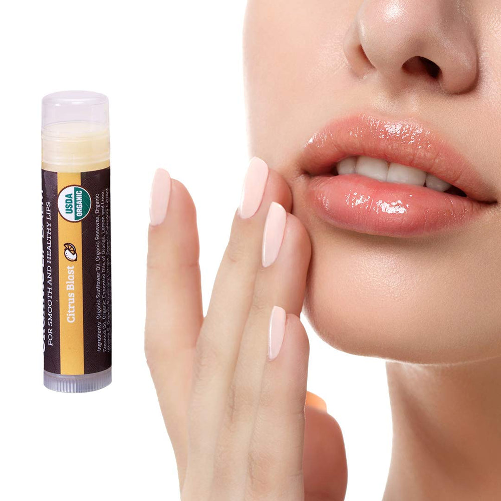 Earth's Daughter citrus lip balm in use during outdoor activities, offering steady moisture.