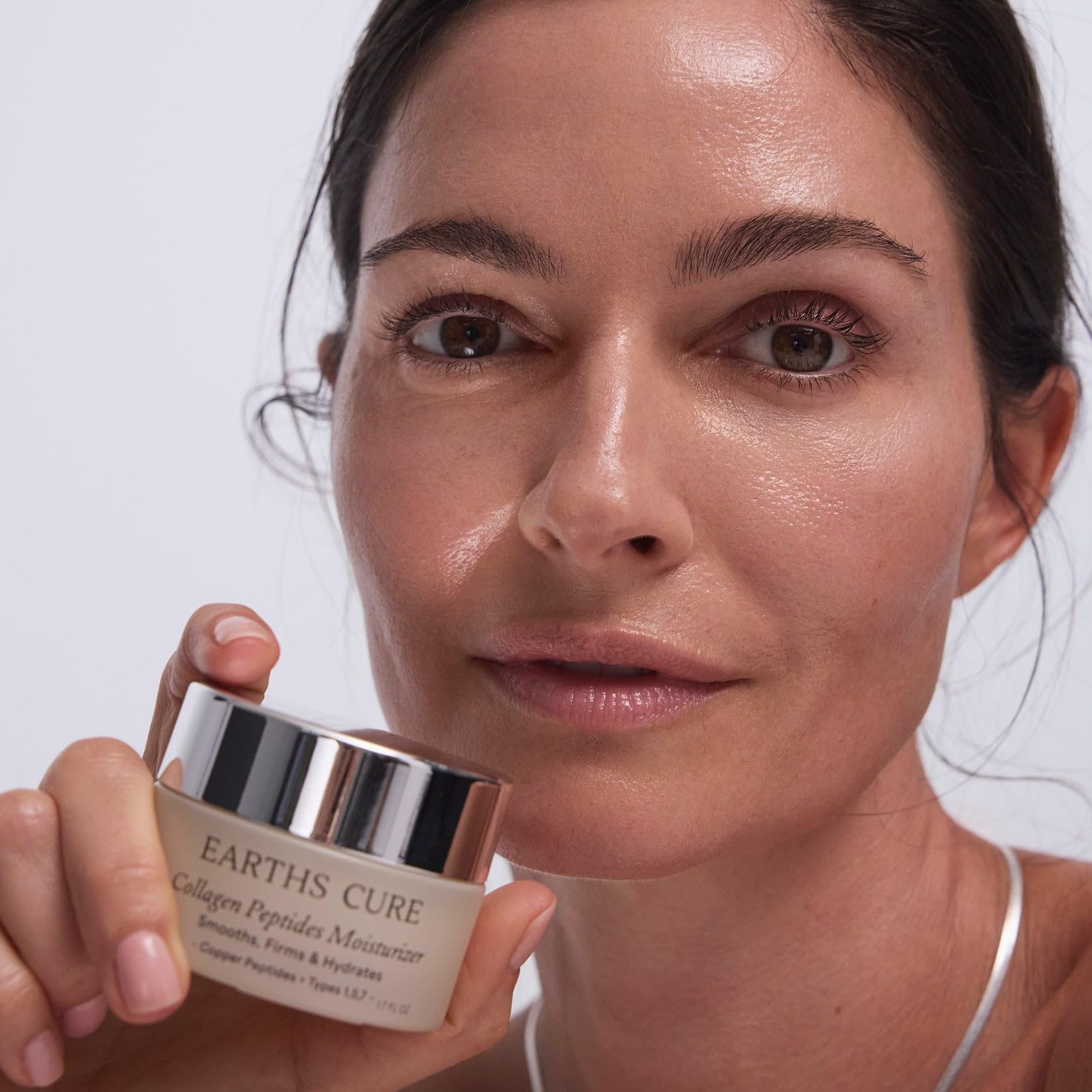 EarthsCure Nano Peptide Moisturizer on the neck area to lift and firm