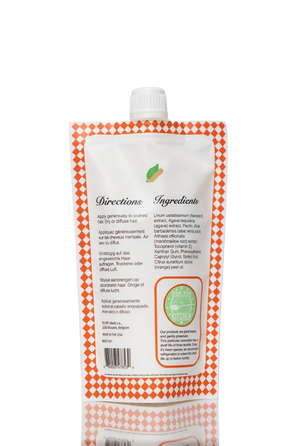 Ecoslay Orange Marmalade shine curls under light shows lustrous, hydrated curls.