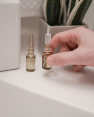 Ampoule application on scalp demonstrating targeted care for thinning hair