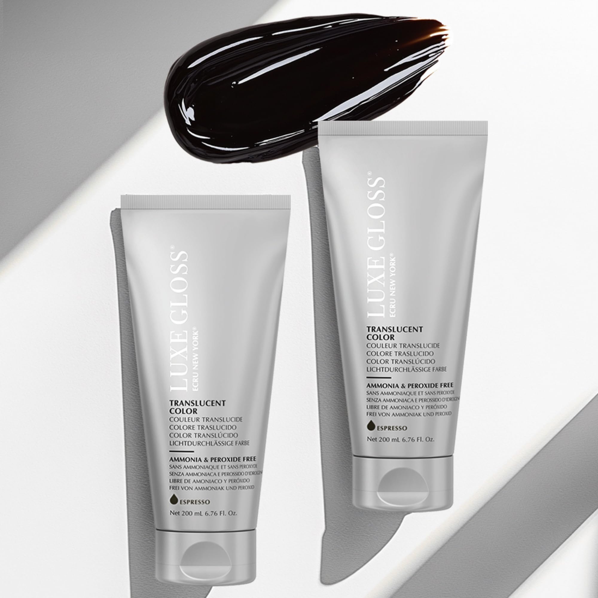 Creamy texture from Ecru New York LUXE GLOSS coats strands.