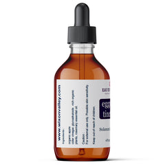 Eggplant Tincture bottle shown on thickened, scaly skin for texture improvement
