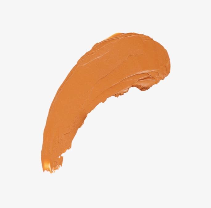 Elaluz stick bronzer in palm application for easy glow on face and body.