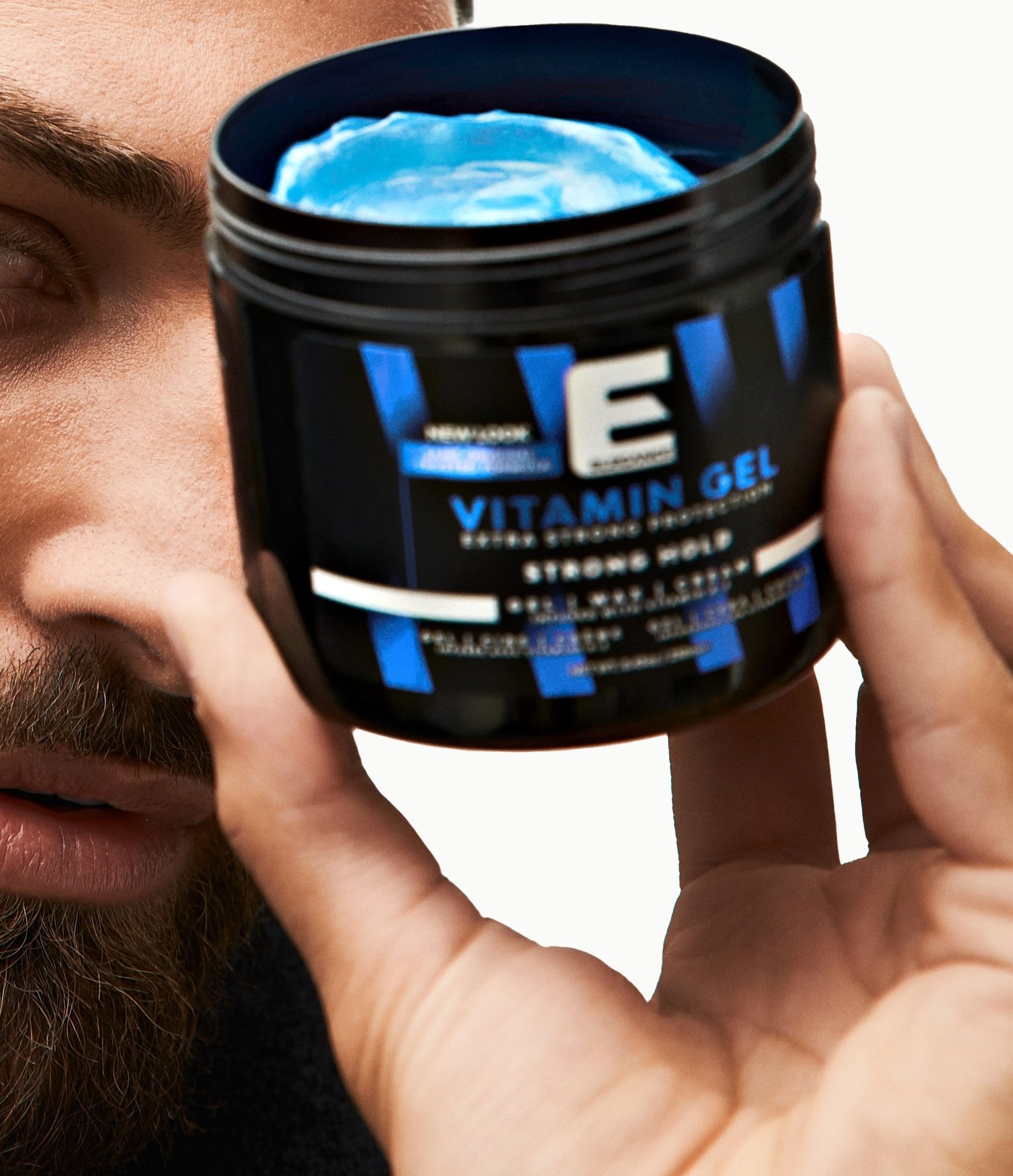 Person styling hair with E Elegance Vitamin Gel during routine.