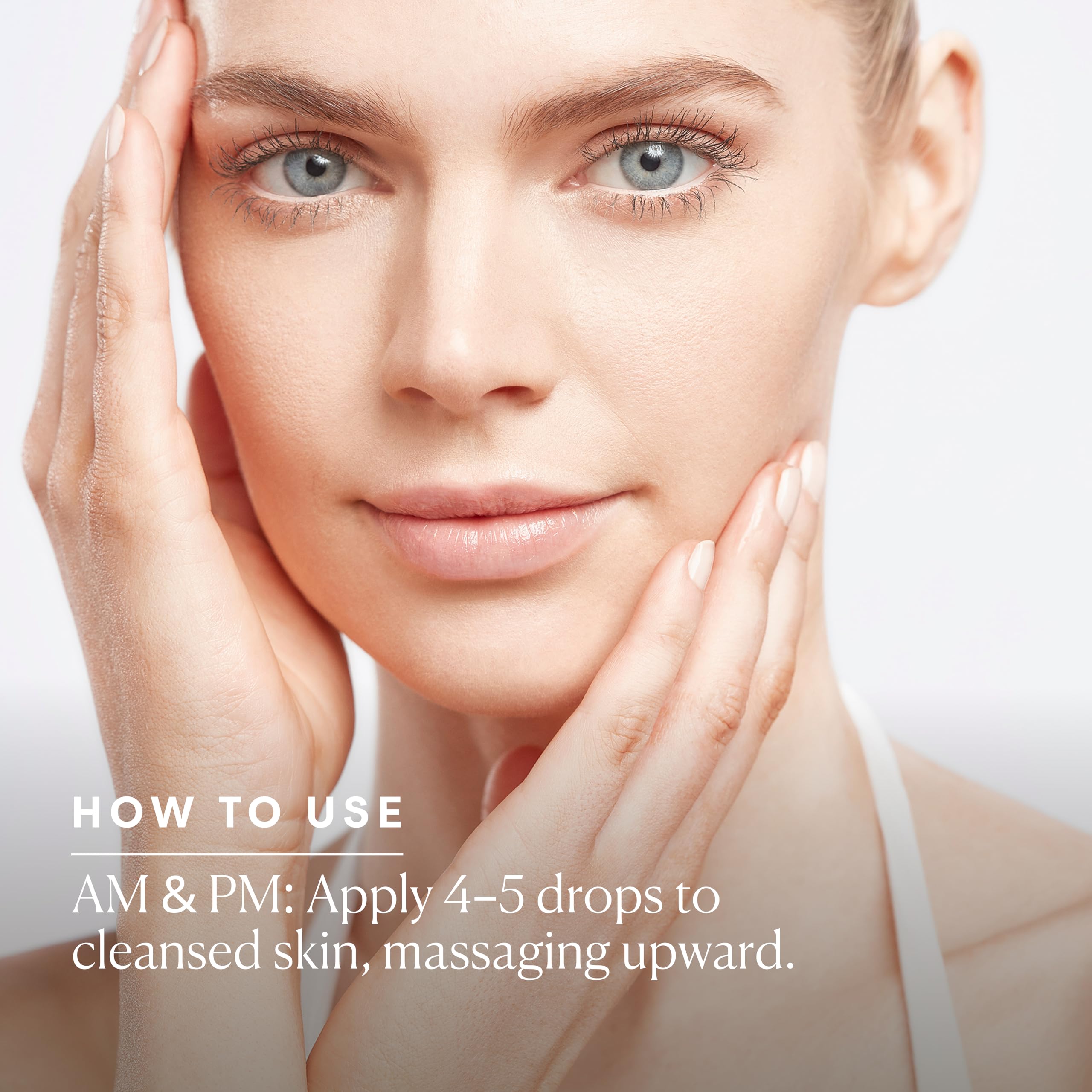 Applying Elemis serum to face during skincare routine