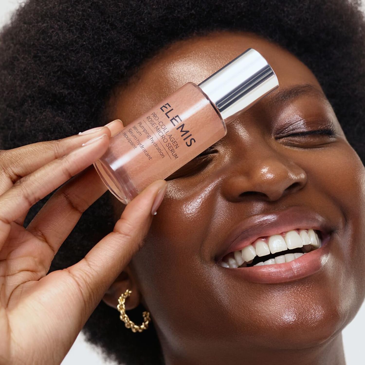 Elemis Pro-Collagen Rose Micro Serum being applied to clean skin.