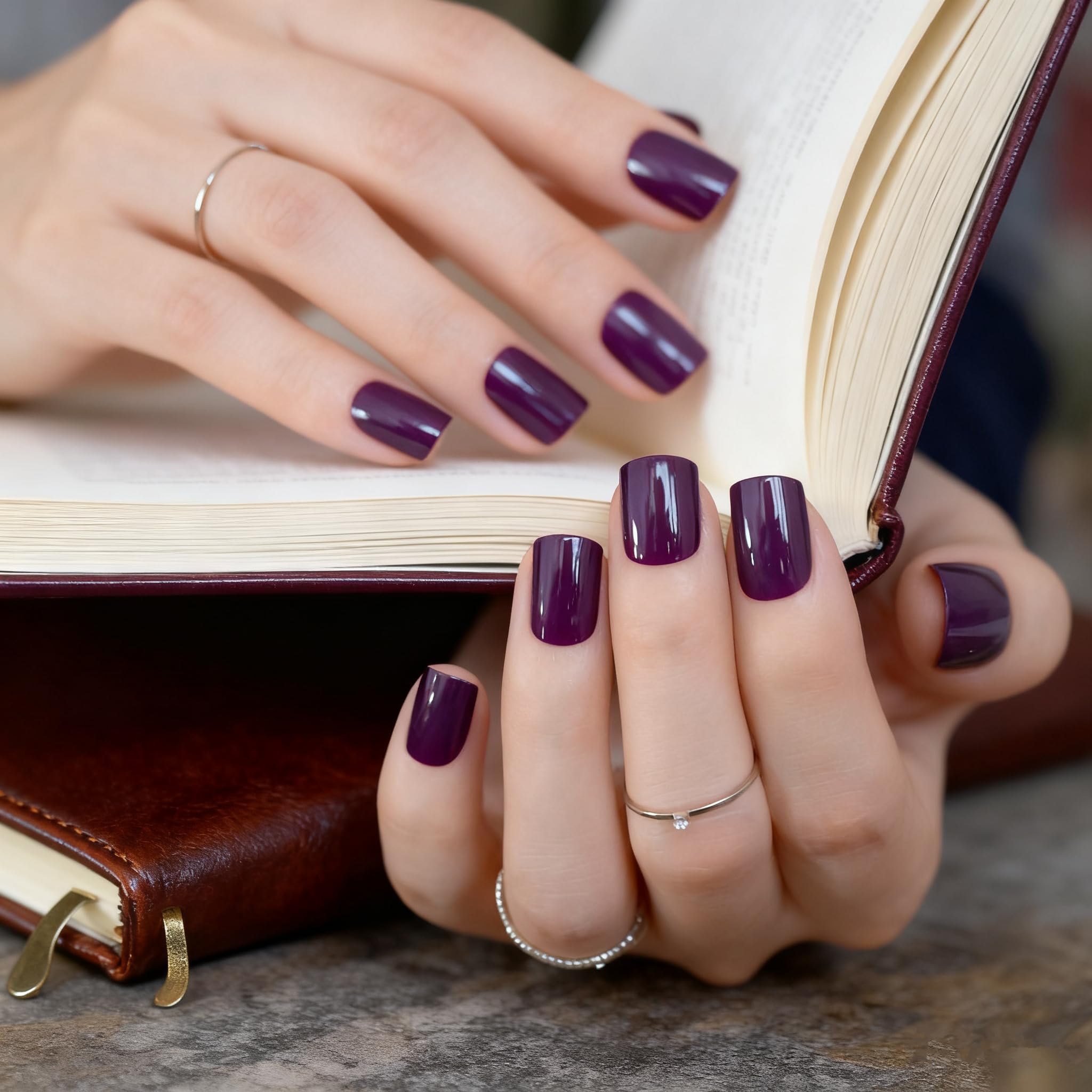 Elevenail nails on fingertips showing medium squoval shape and shine