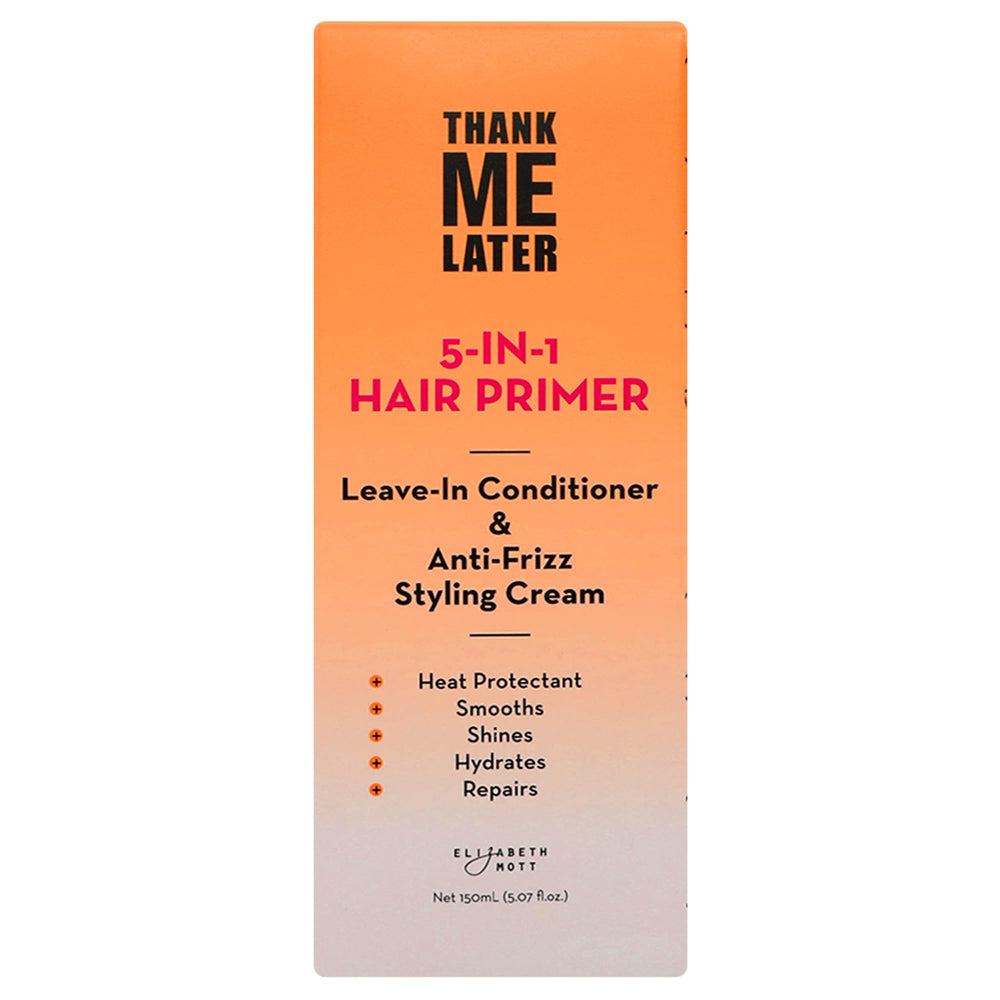 Hands applying Elizabeth Mott Thank Me Later primer to damp hair for smoother styling.