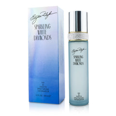 Elizabeth Taylor Sparkling White Diamonds spray on skin for lasting elegance.