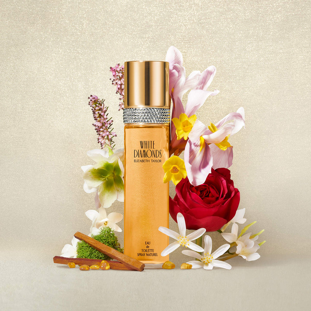 Elizabeth Taylor White Diamonds body powder on skin shows soft, radiant touch.
