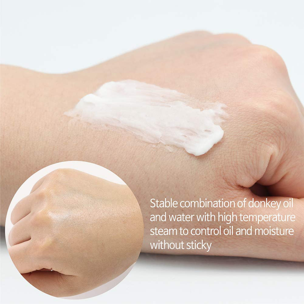 Elizavecca Donkey Steam Milky Cream texture swirls on the surface for smooth application.