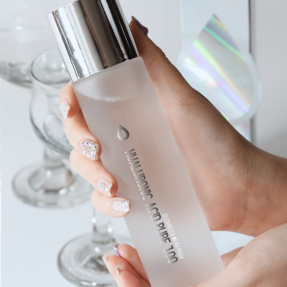 Close-up of Elizavecca serum texture on fingertips for smoother skin.