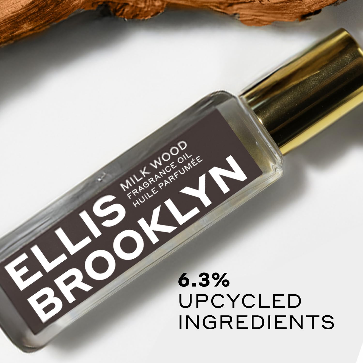 Ellis Brooklyn Milk Wood on skin at pulse points, showcasing lasting aroma