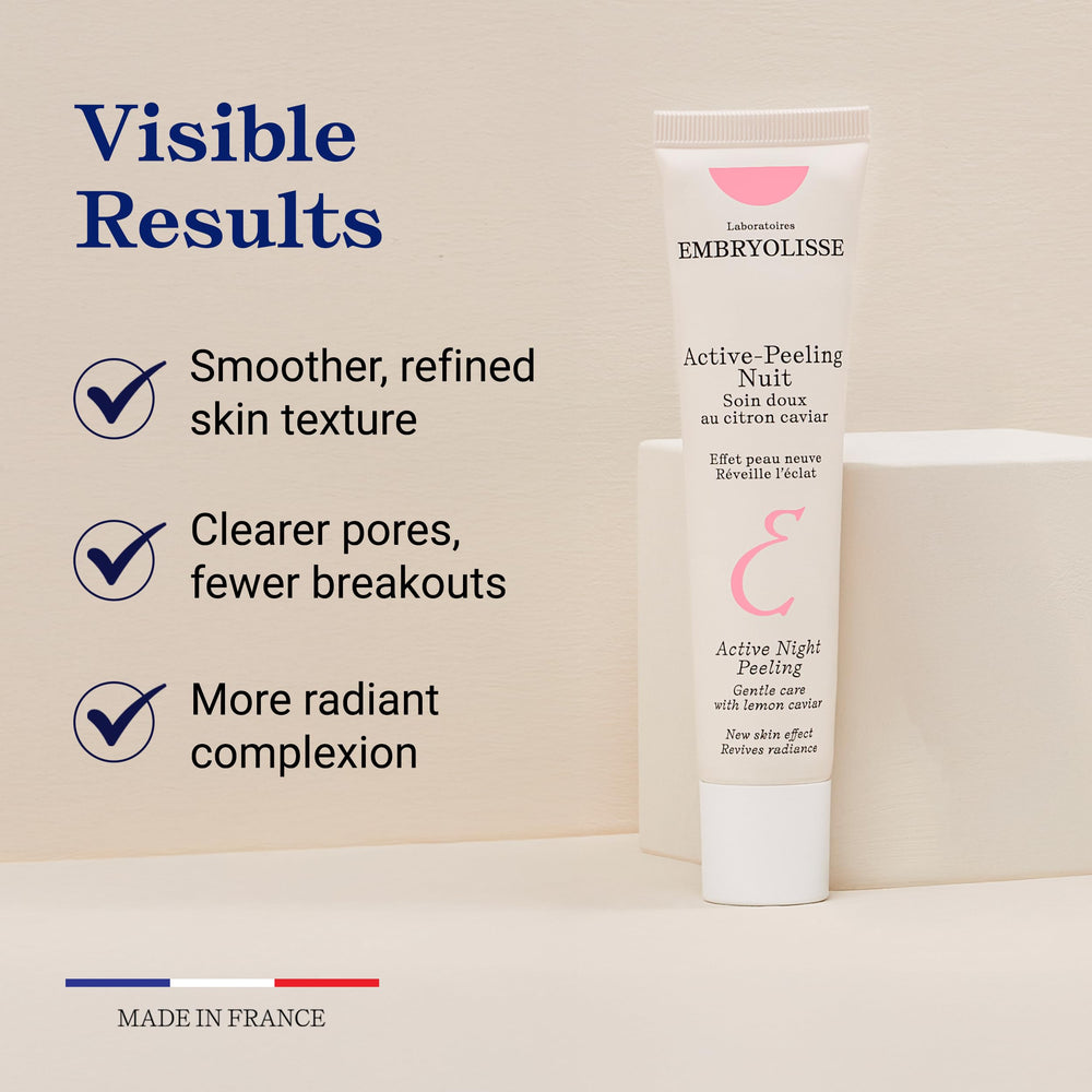 Embryolisse Active Night Peeling cream swirl on a neutral surface.