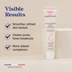 Embryolisse Active Night Peeling cream swirl on a neutral surface.