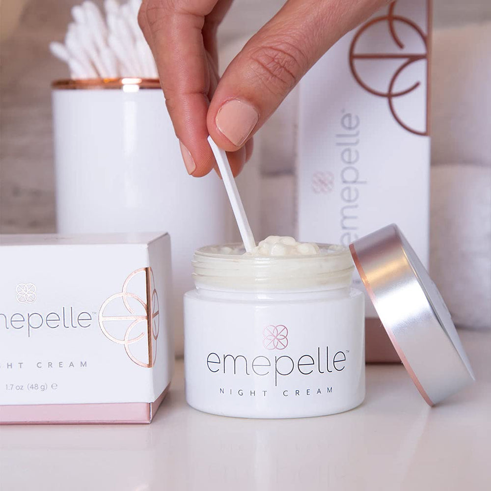 Emepelle Night Cream face application close-up demonstrating smooth, even nighttime use.