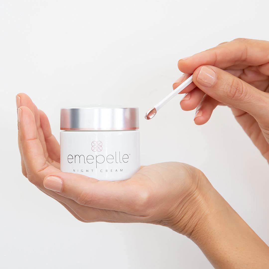 Emepelle Night Cream jar close-up illustrating rich texture for nourishing skin at night.