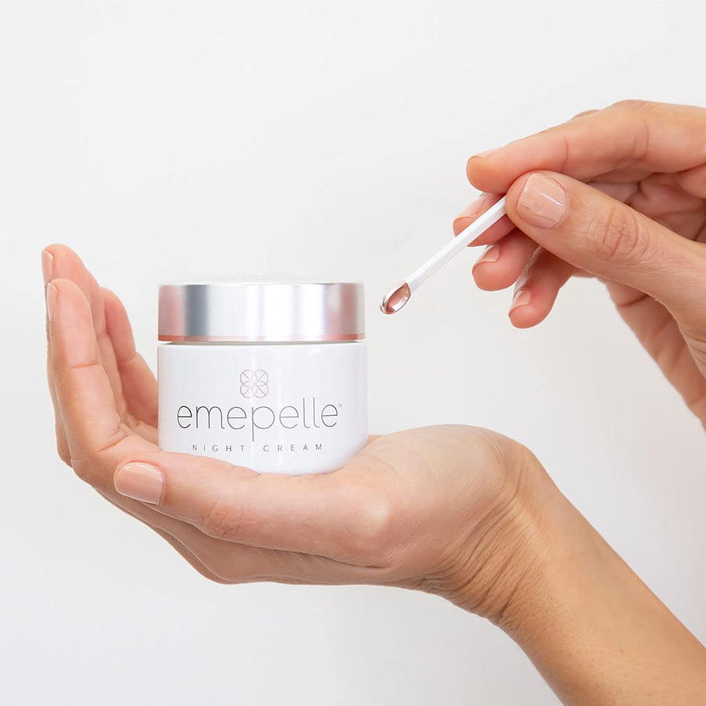 Emepelle Night Cream jar close-up illustrating rich texture for nourishing skin at night.