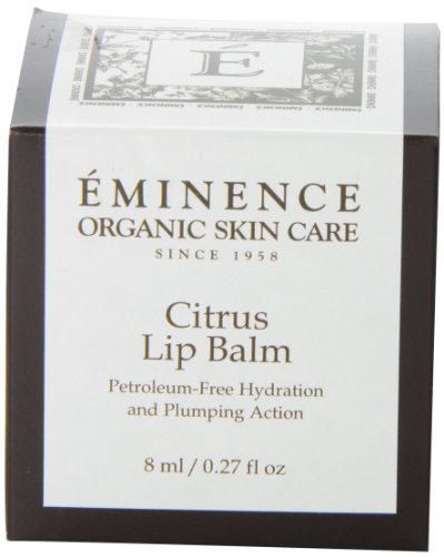 Applying Eminence Citrus Lip Balm for soothing, hydrated lips.