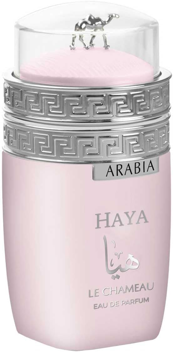 Emper Arabia Haya bottle close-up with spray mist, showcases rich floral musk notes.