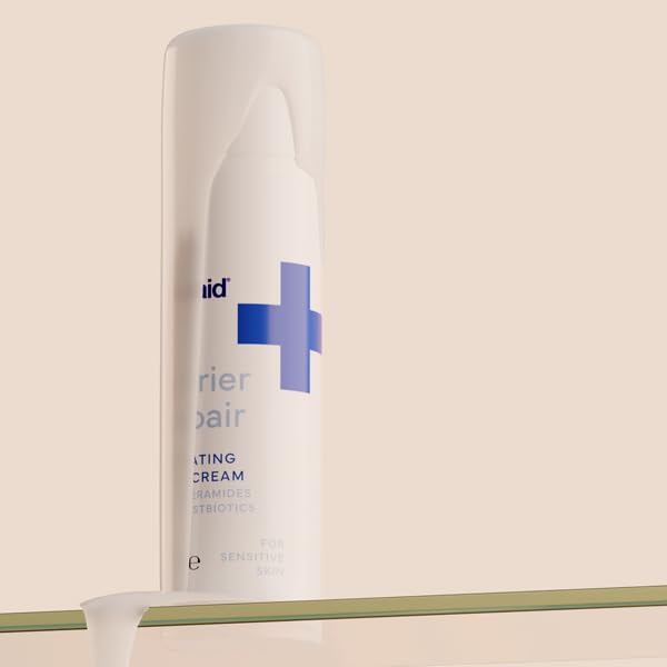 Applying Emuaid Barrier Repair Cream to the hand demonstrates facial moisturizer use.