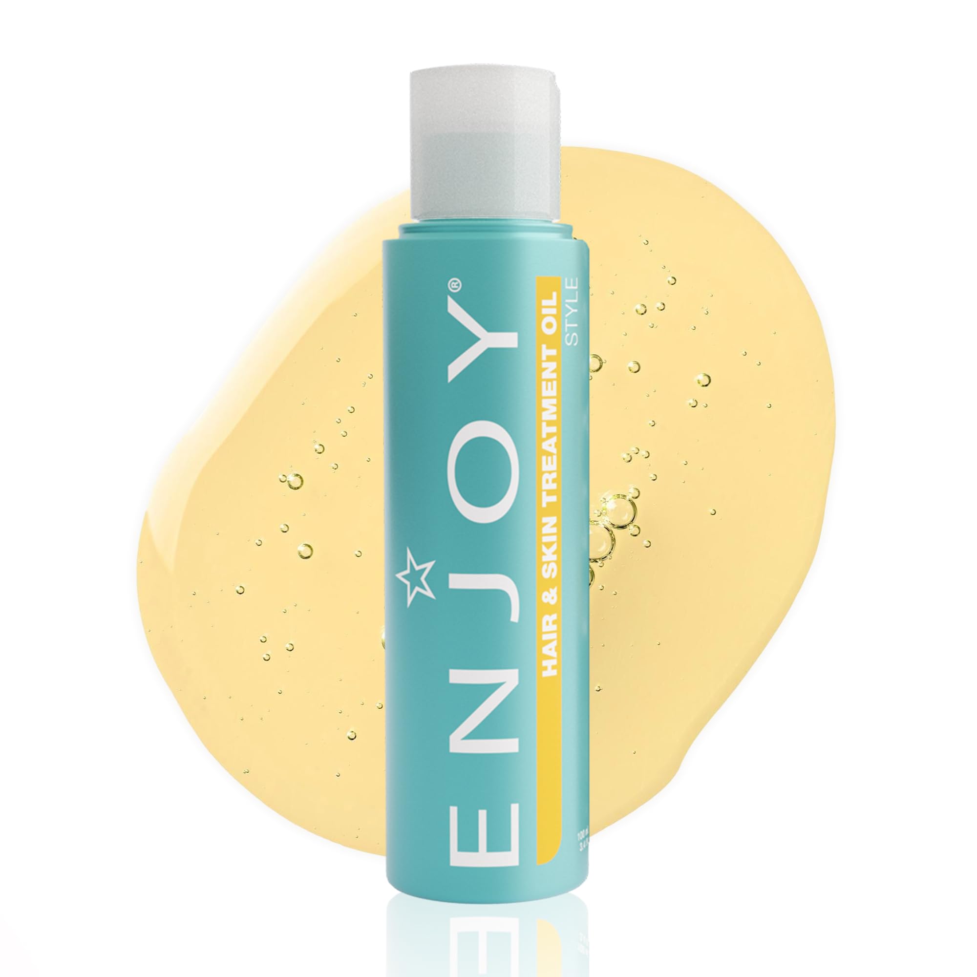 Enjoy Hair & Skin Treatment Oil bottle pour for quick, non-greasy hydration.