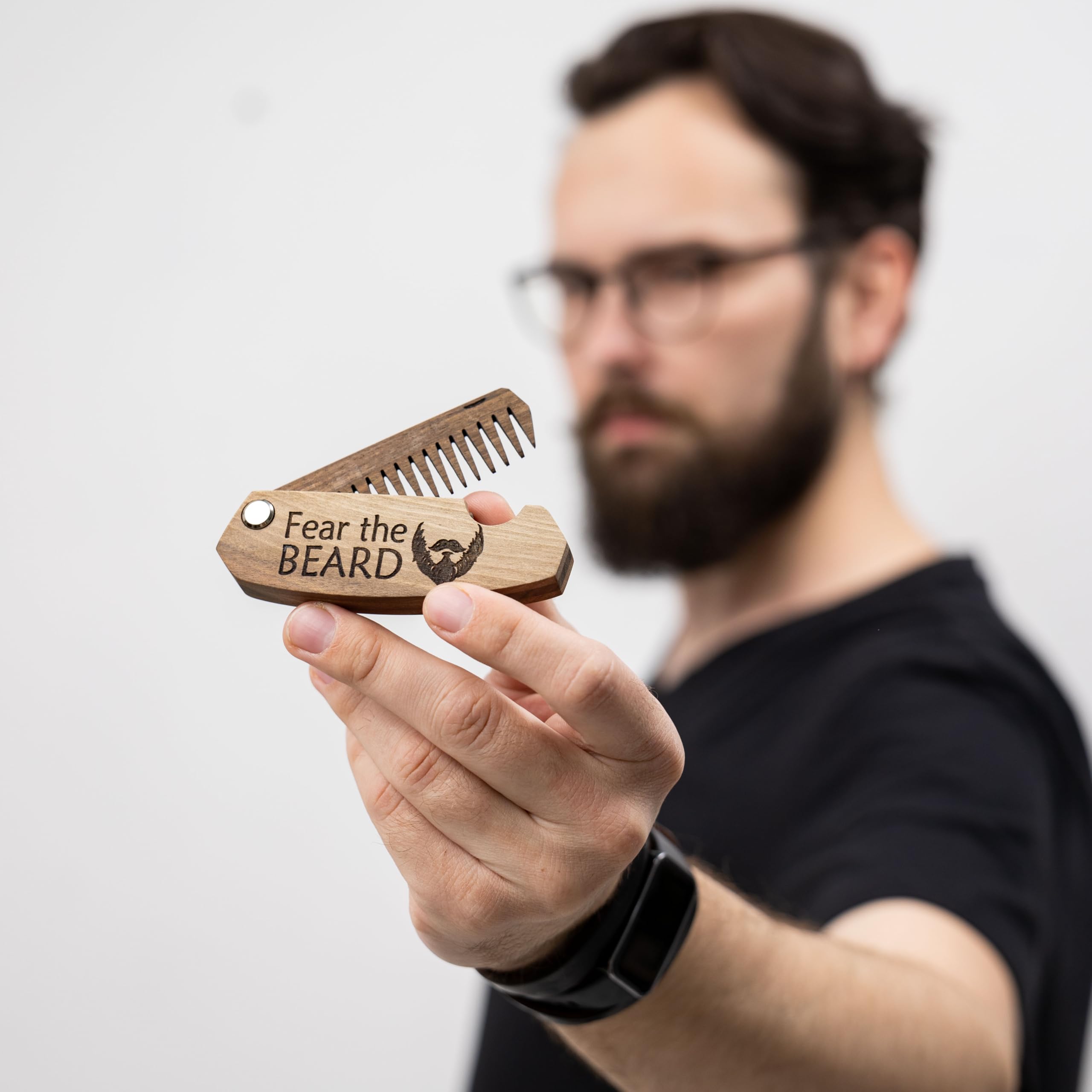 Enjoy The Wood engraving Fear The Beard on the beard comb as a bold personal touch
