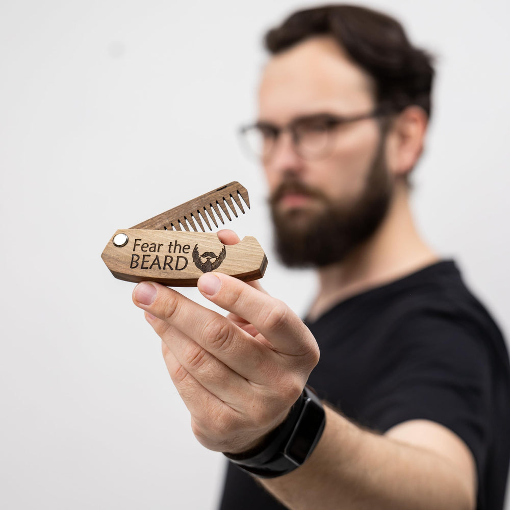 Enjoy The Wood engraving Fear The Beard on the beard comb as a bold personal touch
